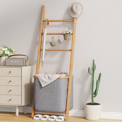 Wall leaning storage rack with hamper sales